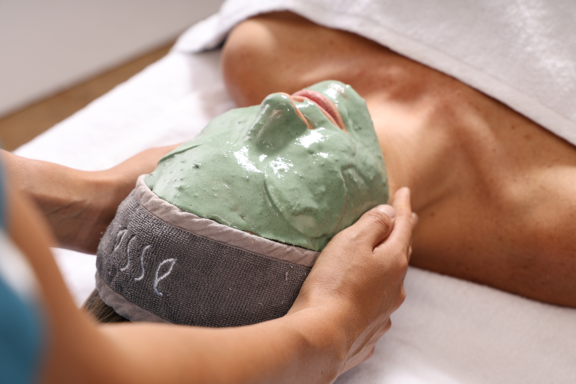 Green treatment mask being applied